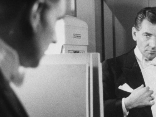 Composer/conductor Leonard Bernstein looking intently at himself in the mirror as he dresses for concert which he will conduct at Carnegie Hall. (Photo by Alfred Eisenstaedt/The LIFE Picture Collection/Getty Images)