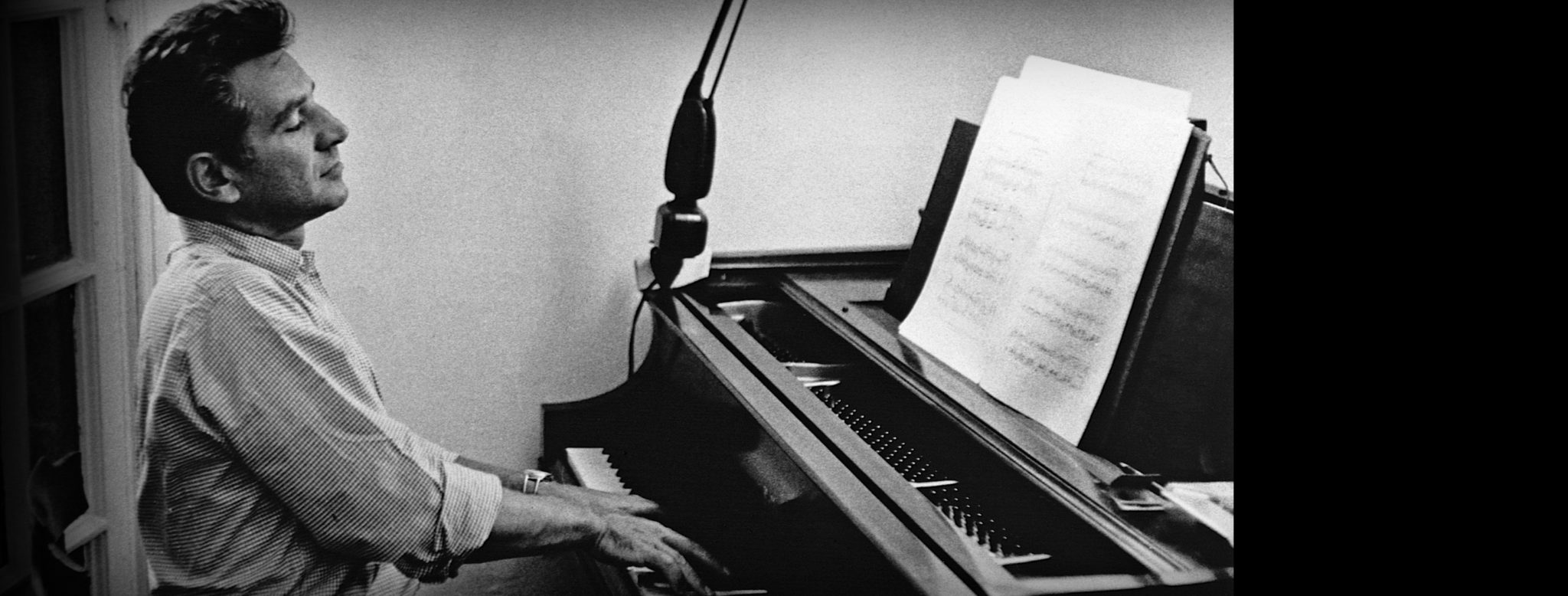 Leonard Bernstein (1918-1990) works at his piano. Bernstein was a prolific composer, best known for musicals such as "West Side Story." He also conducted the New York Philharmonic Symphony from 1957 until his death, and was primarily responsible for bringing the music of Gustav Mahler to a greater public audience in the United States. / Credit: © CORBIS/Corbis via Getty Images