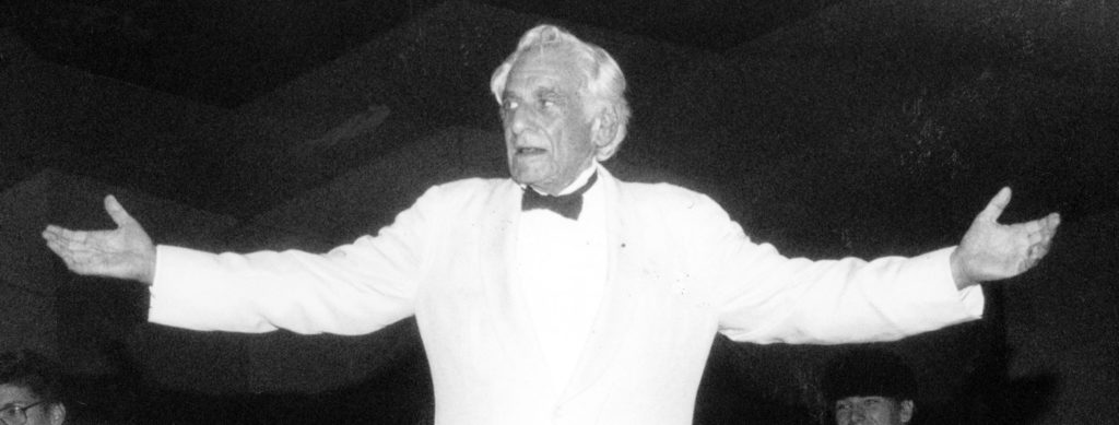 Leonard Bernstein acknowledges the applause following the performance with the Tanglewood Music Center Orchestra in the Koussevitzky Music Shed at Tanglewood, August 14, 1990. Photo: Ron Barnell | Boston Symphony Orchestra Archives.
