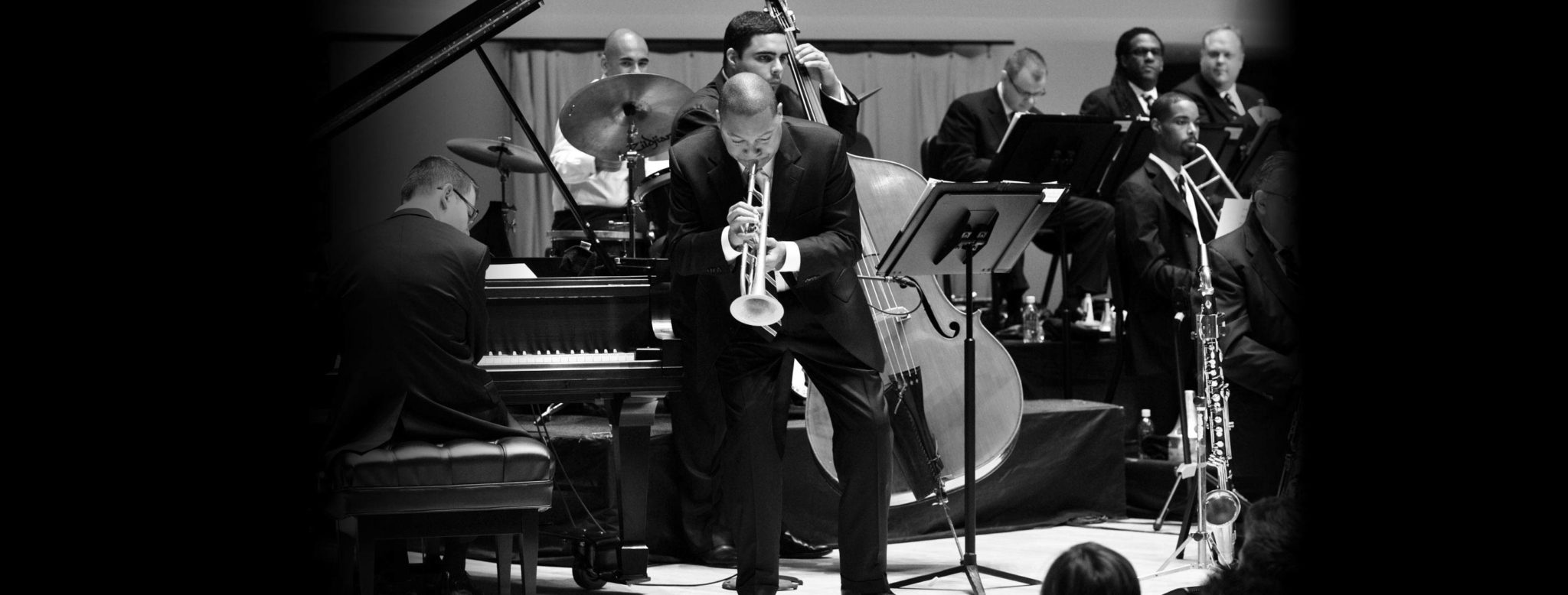 Wynton Marsalis bends to the music during a concert. (Credit: Frank Stewart)