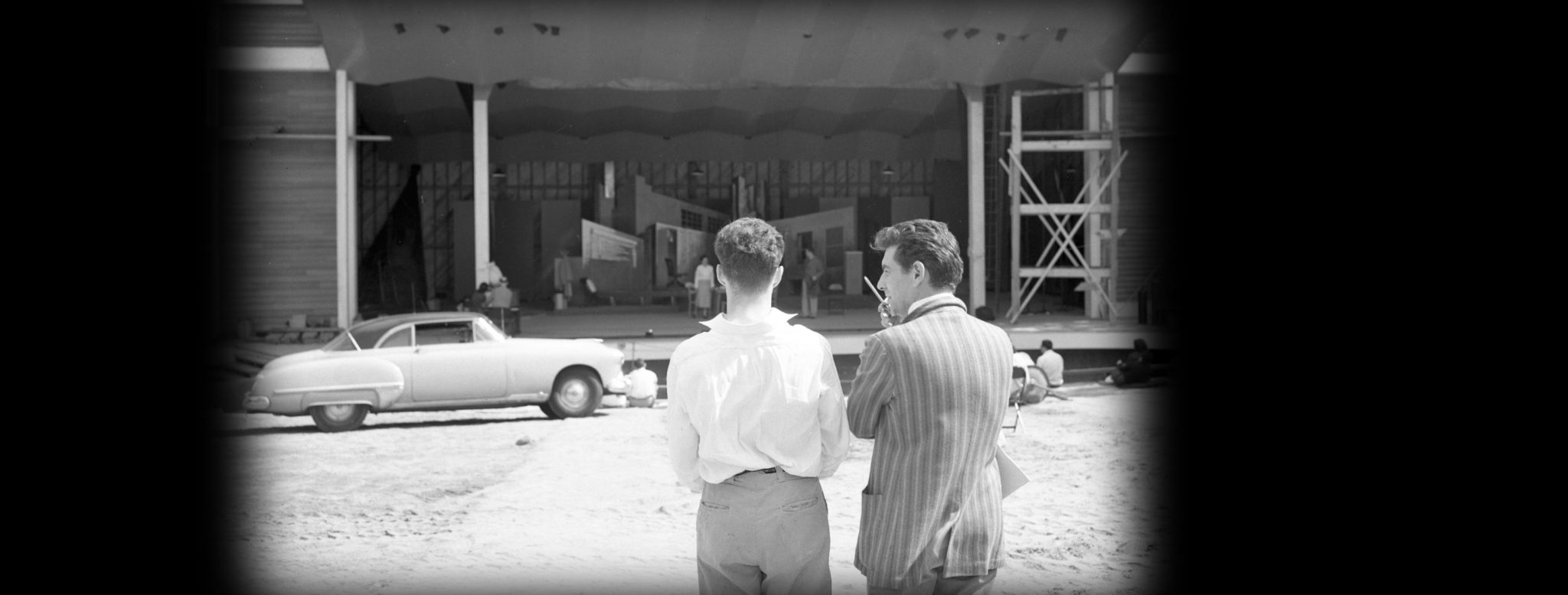 Leonard Bernstein (right) in front of the stage set for "Trouble in Tahiti," 1952. (Courtesy of the Robert D. Farber University Archives & Special Collections Department, Brandeis University.)